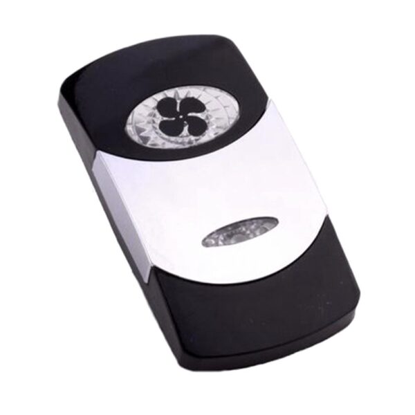 Actuator Contura VI, black, bright chrome plated, low insert, oval lens and bar lens clear, symbol "ventilation fan or blower"